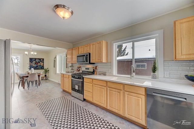 700 4th, Deer Lodge, MT 59722 - kitchen with a sink, stainless steel appliances, backsplash, and light brown cabinets