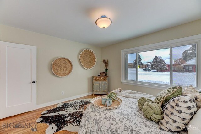 700 4th, Deer Lodge, MT 59722 - bedroom with baseboards and wood finished floors