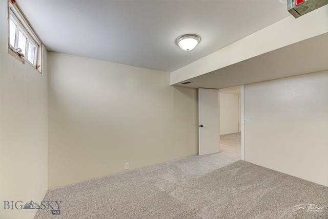 700 4th, Deer Lodge, MT 59722 - below grade area featuring carpet flooring and visible vents