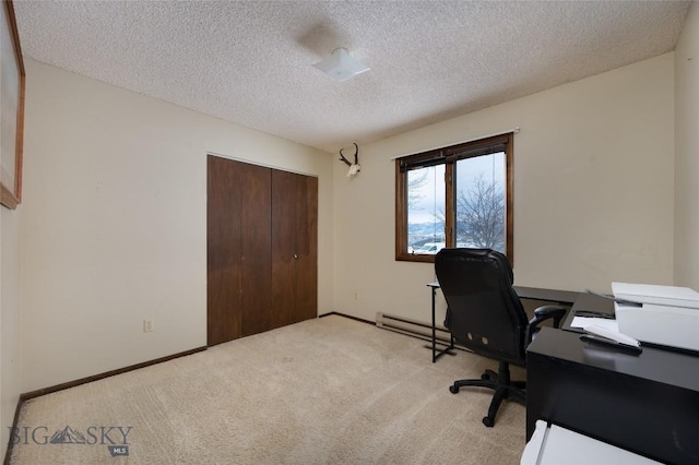 office area featuring light carpet, a textured ceiling, and baseboards