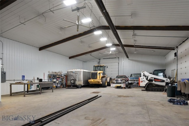 garage with metal wall and a workshop area