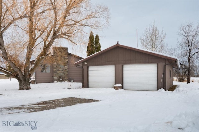 exterior space featuring a detached garage