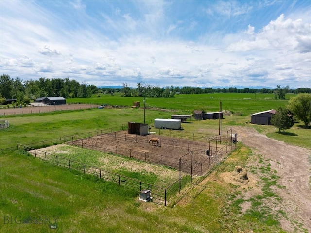 2521 Weaver Ln, Belgrade, MT 59714 - view of yard featuring a view of countryside, an outdoor structure, an enclosed riding area, and an exterior structure