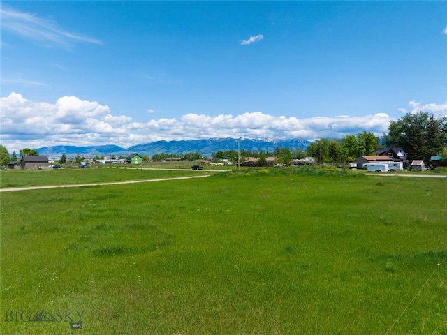 2521 Weaver Ln, Belgrade, MT 59714 - view of home's community with a mountain view, a rural view, and a lawn