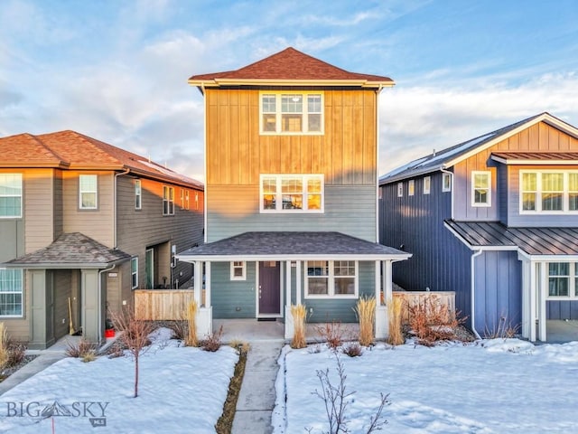 view of front of property featuring a porch, board and batten siding, and a shingled roof