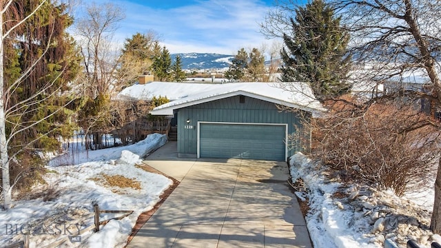 view of snow covered garage