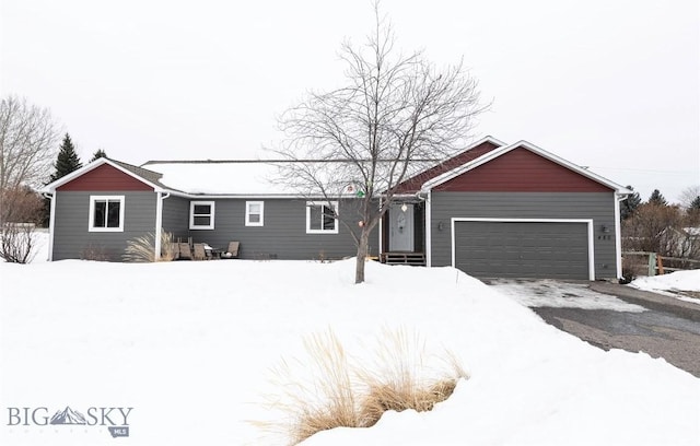 ranch-style house featuring an attached garage