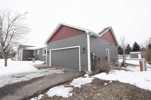 view of snow covered garage