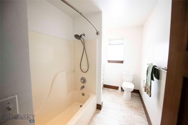 full bathroom featuring toilet, bathtub / shower combination, baseboards, and tile patterned floors