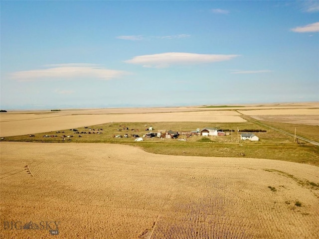 birds eye view of property with a rural view