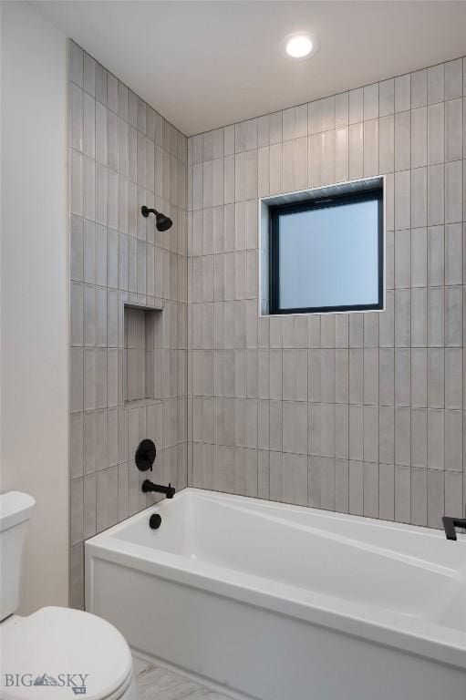 bathroom featuring toilet and shower / bathtub combination