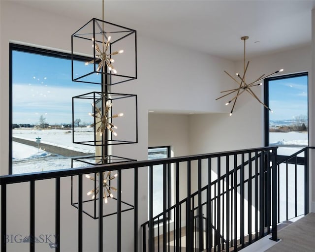 stairway with an inviting chandelier