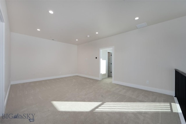 interior space featuring carpet, baseboards, and recessed lighting