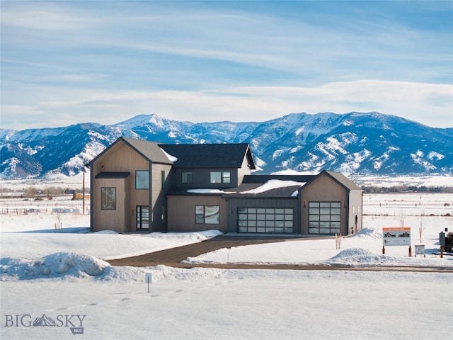 view of front of home with a mountain view and an attached garage