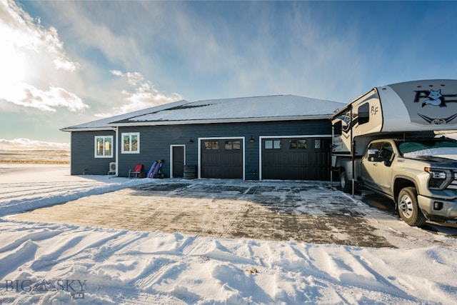 view of side of property featuring a garage