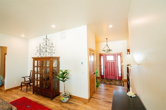 entrance foyer with baseboards, recessed lighting, visible vents, and light wood-style floors