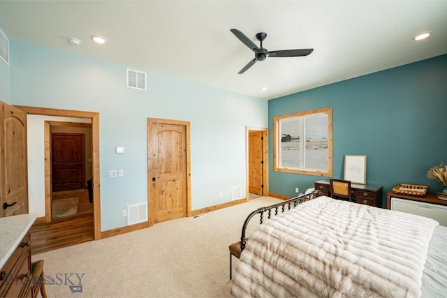 carpeted bedroom with recessed lighting, visible vents, and baseboards