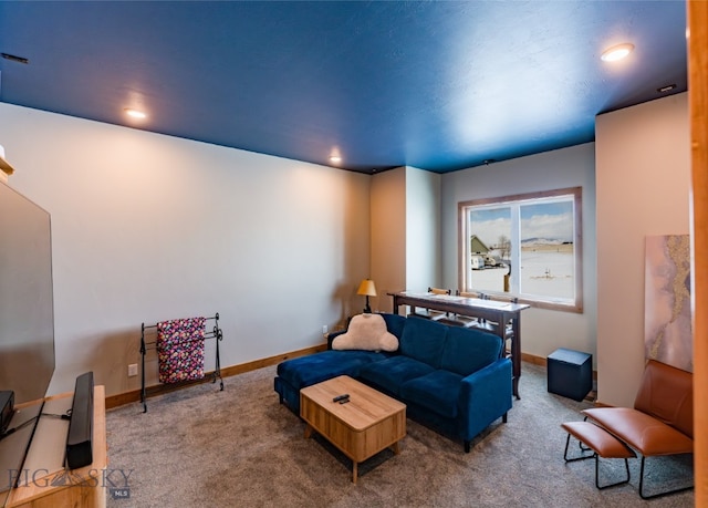 living room featuring carpet floors, recessed lighting, and baseboards