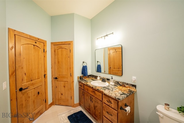 half bath with vanity and toilet