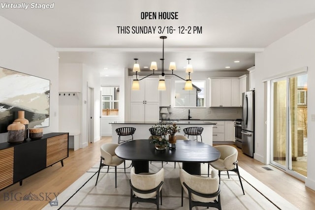 dining area featuring recessed lighting, visible vents, an inviting chandelier, and light wood-style floors