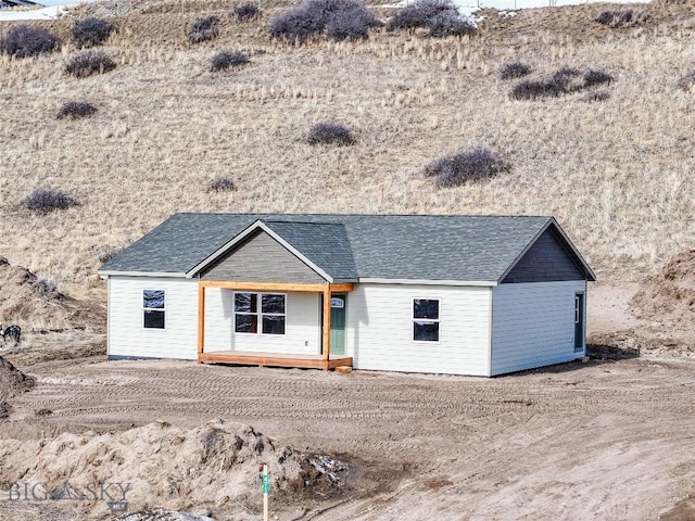 view of front of home with roof with shingles