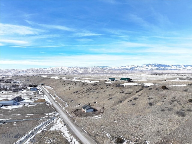 birds eye view of property with a mountain view