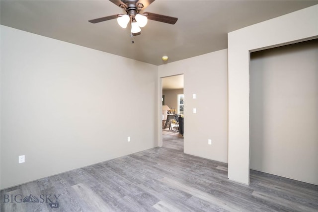 unfurnished bedroom with ceiling fan and wood finished floors