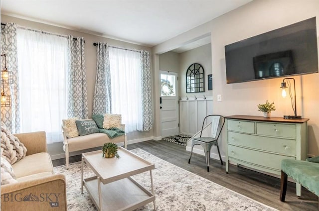 sitting room featuring dark wood-style floors and baseboards