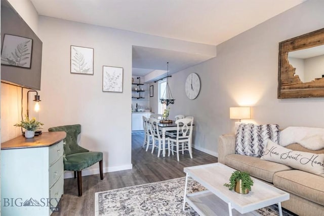 living room with wood finished floors and baseboards