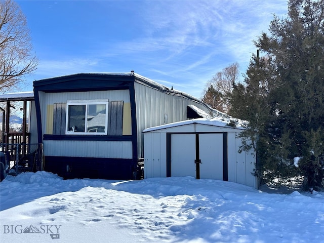 exterior space featuring a storage shed and an outdoor structure