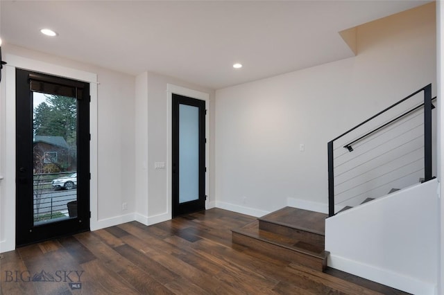 entryway with recessed lighting, stairway, baseboards, and wood finished floors