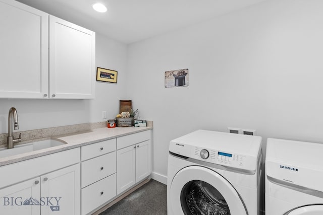 laundry area with recessed lighting, cabinet space, a sink, and separate washer and dryer