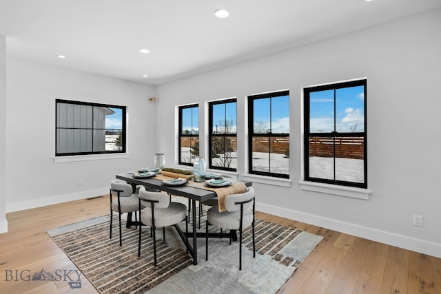 dining room with light wood-style flooring, visible vents, baseboards, and recessed lighting