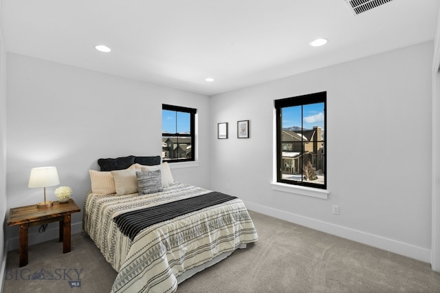 bedroom featuring carpet, visible vents, baseboards, and recessed lighting