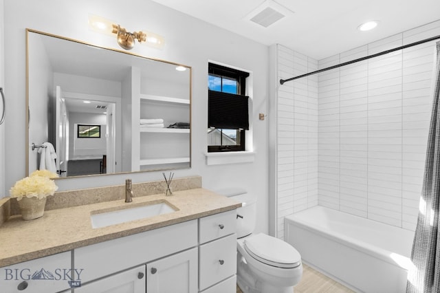 full bath featuring recessed lighting, visible vents, toilet, shower / tub combo, and vanity