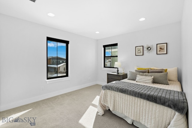 bedroom with recessed lighting, carpet flooring, and baseboards