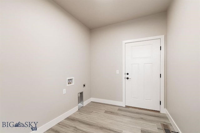 laundry area featuring laundry area, washer hookup, baseboards, light wood-type flooring, and electric dryer hookup