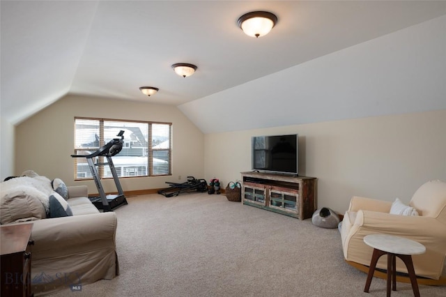 interior space featuring lofted ceiling and carpet floors