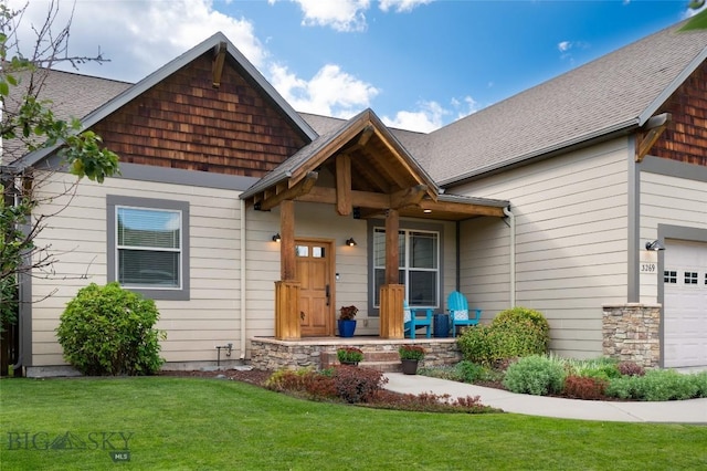 craftsman-style house featuring a porch and a front yard