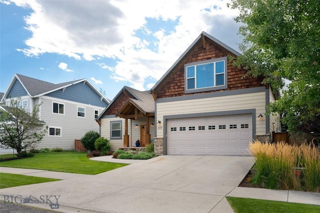 view of front of house with a front yard, stone siding, driveway, and an attached garage