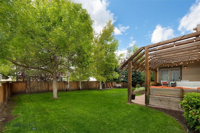 view of yard featuring a fenced backyard, a patio, and a pergola