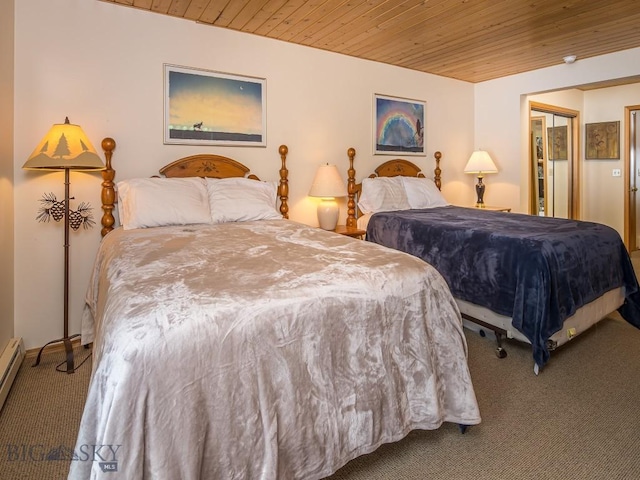 bedroom with a baseboard heating unit, carpet flooring, and wood ceiling