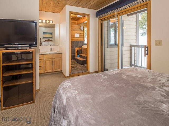 bedroom with carpet, access to outside, wooden ceiling, and a sink