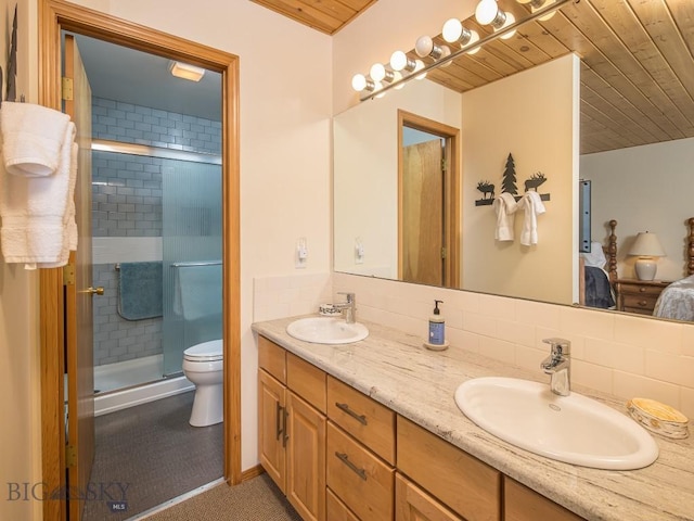 ensuite bathroom featuring tasteful backsplash, ensuite bath, wooden ceiling, and a sink