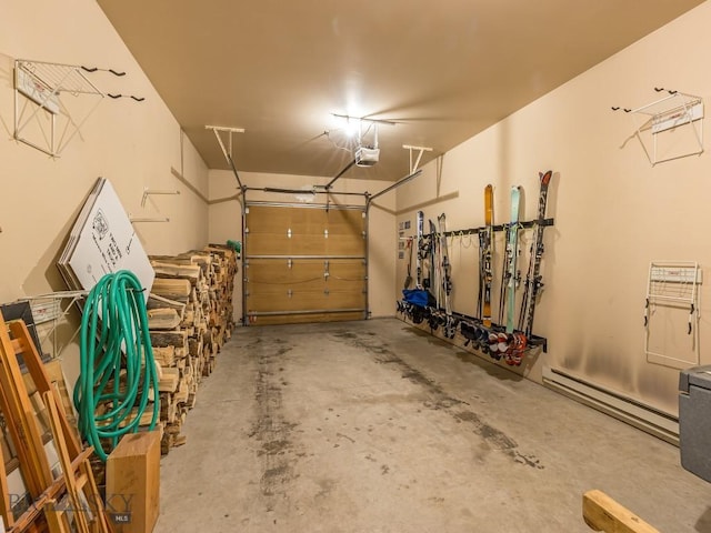 garage with a garage door opener and baseboard heating