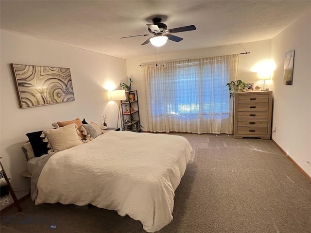 bedroom featuring a ceiling fan, carpet flooring, and baseboards