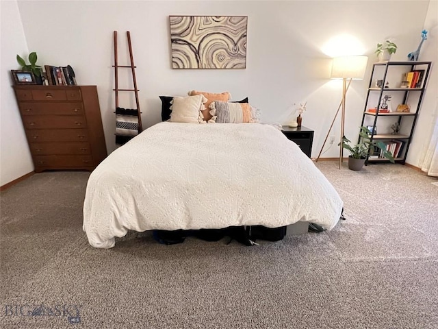 carpeted bedroom with baseboards