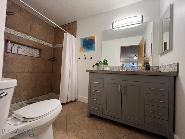 full bathroom with tiled shower, tile patterned flooring, and toilet