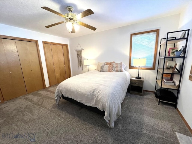 bedroom with baseboards, carpet floors, a ceiling fan, and multiple closets