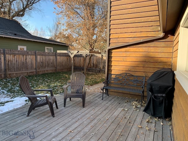 deck featuring a fenced backyard and area for grilling